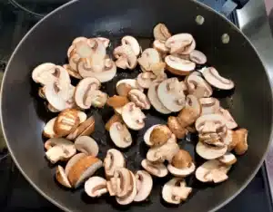 The sliced mushrooms should now be added to the pan for Texas Roadhouse Sautéed Mushroom Recipe.