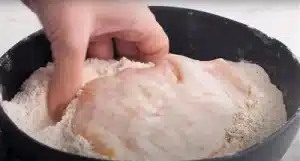 Make sure that each piece of chicken is evenly coated on all sides before dredging it in the seasoned flour mixture cote the chicken 2 times into the buttermilk and flour for Texas Roadhouse Country Fried Chicken Recipe.