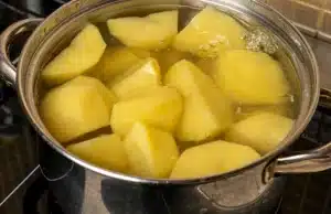 When the water is boiling, carefully cook them until they are soft to the touch for Texas Roadhouse Mashed Potatoes Recipe.