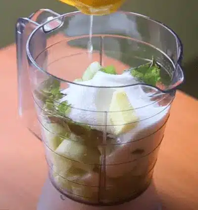 Cut two limes in half and squeeze out the juice into the shaker.