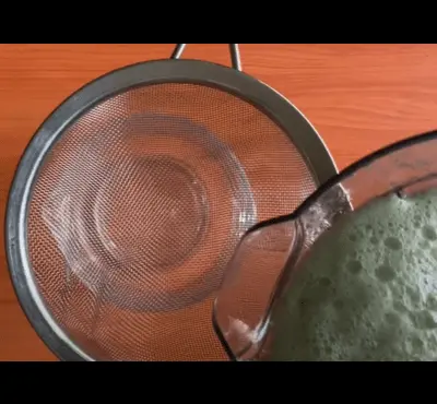 strain the cucumber-mint-lime mixture into a pitcher.