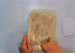 Add 300 grams of '00' flour to the bowl and mix until combined