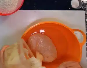 First we have taken water in the bowl and now we are adding poolish because this is our yeast for Vito Iacopelli Pizza Dough Recipe.