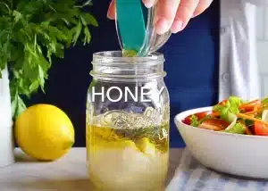 Add 2 teaspoons of minced garlic, 1 teaspoon each of dried basil, oregano, parsley, and thyme, as well as 3 tablespoon of honey for Texas Roadhouse Italian Salad Dressing Recipe.