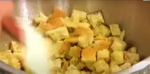 Over the bread cubes, season with salt, freshly ground black pepper, and grated parmesan cheese for Texas Roadhouse Crouton Recipe
