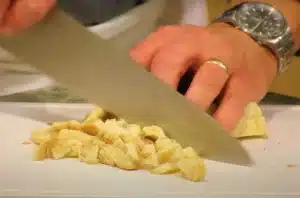 cut the French bread into cubes that will amount to four cups for Texas Roadhouse Crouton Recipe