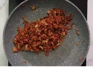 Now take 250 grams of bacon in another frying pan and fry it well for Texas Roadhouse Bacon Cheese Fries Recipe